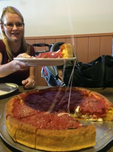 Jules with a slice of Chicago Deep Dish Pizza... Was excellent!!